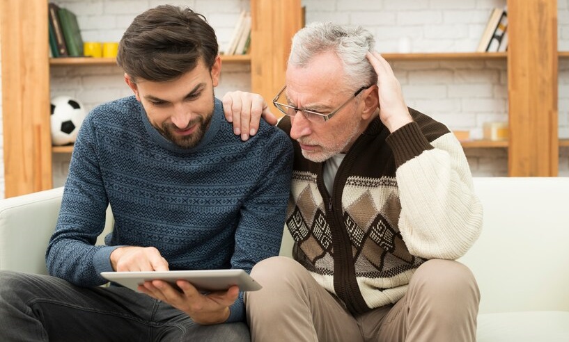 Aged Man With Hand Shoulder Young Guy Using Tablet Settee 23 2148030337 1