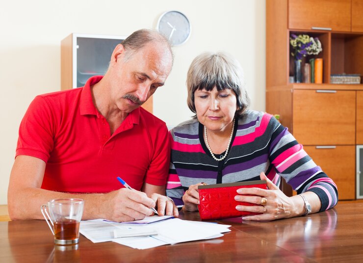 Sad Senior Couple Calculating Budget 1398 4259