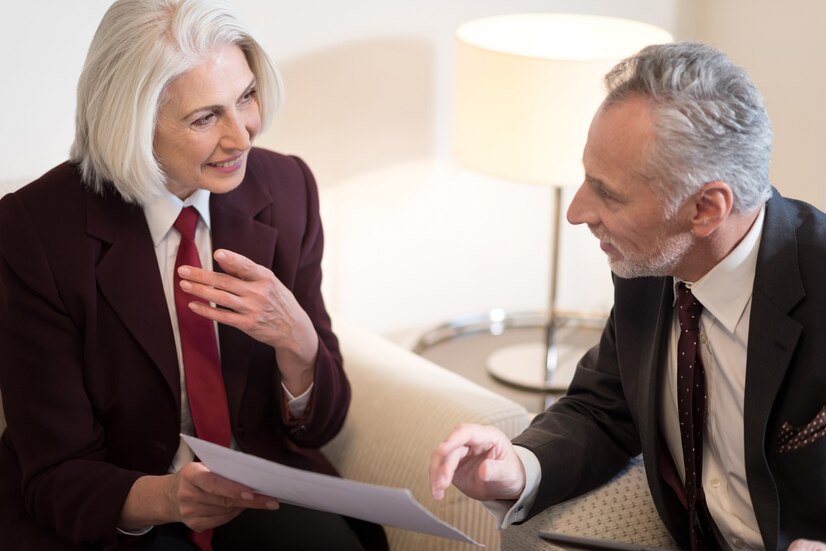 Share Ideas Involved Smiling Aged Businesswoman Holding Papers While Sitting Office Near Her Colleague With Tablet Sharing Ideas 259150 12818