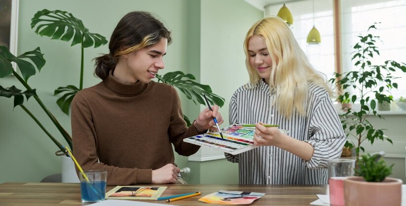 Teenagers Guy Girl Sitting Table With Paints Brushes Drawings 116407 16565